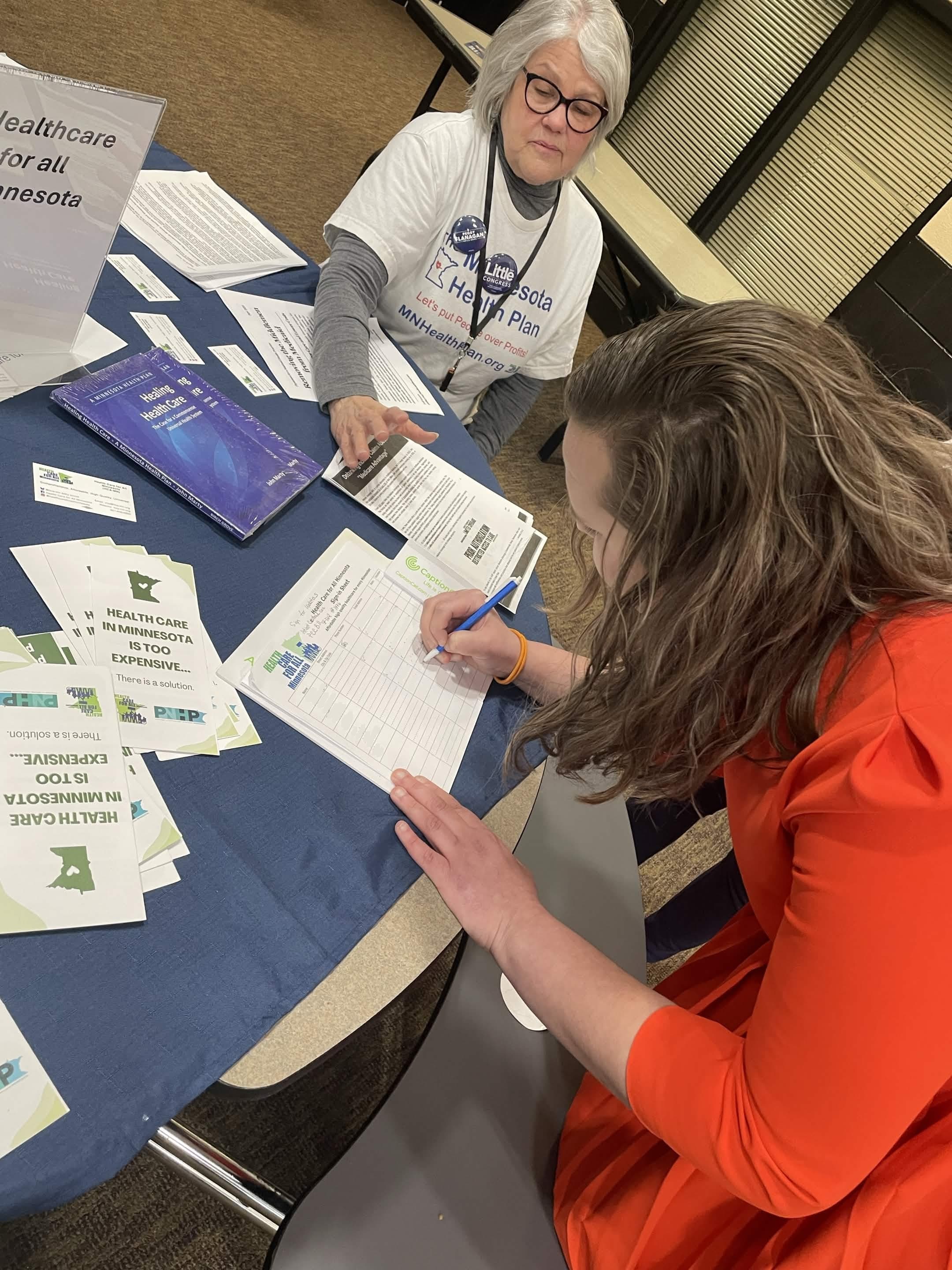 Kobey Layne listening to Minnesotans at a community health care forum